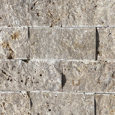 Travertine Tile also comes in a variety of styles and sizes. Travertine Tile is ideal for any raised areas (raised walls , raised spa outer perimeter) above the waterline. 